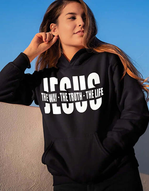 Load image into Gallery viewer, Woman wearing black Christian sweatshirt with &quot;Jesus the Way the Truth the Life&quot; print, perfect for autumn inspiration and warmth.
