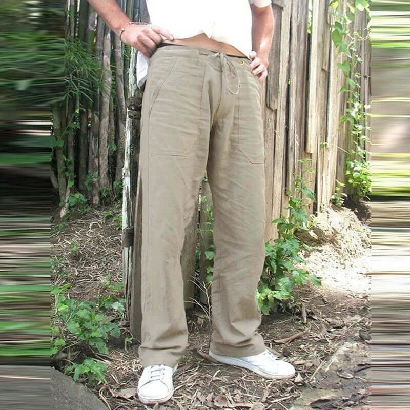 Men's cotton linen trousers in khaki with elastic waist, shown outdoors. Fashionable, casual style for summer in multiple sizes.